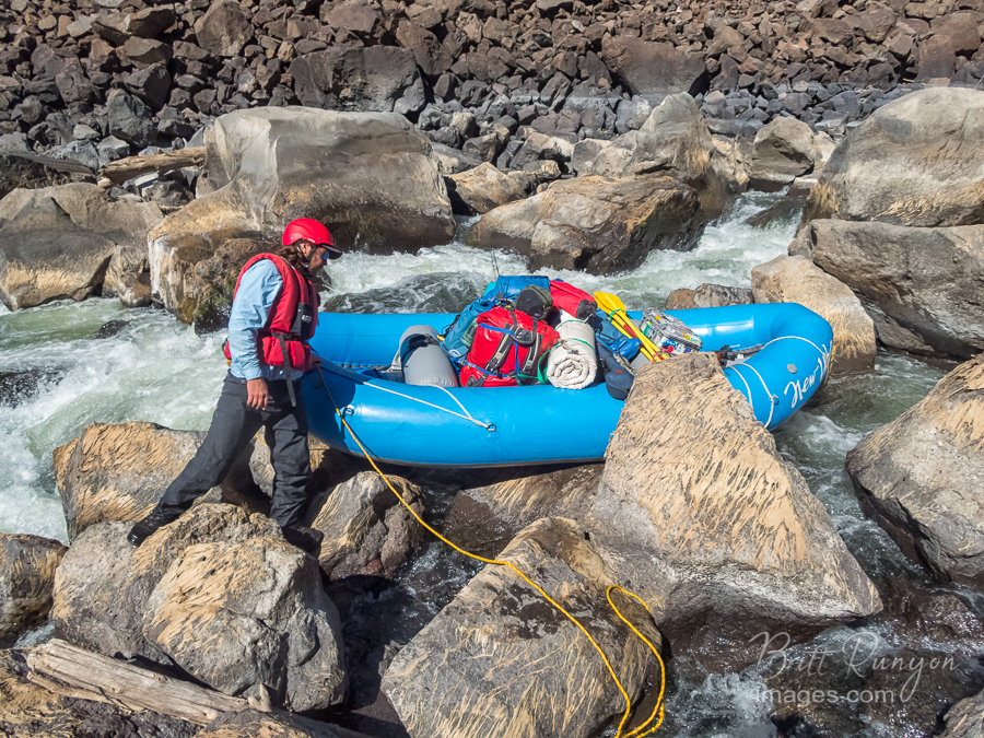 Carrying the raft over the entry boulders.